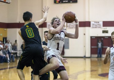 Kings Christian's TJ Hudson earned first team honors in the East Sierra League with his 23.9 points per game. Due to injury he played in just 12 games this season.